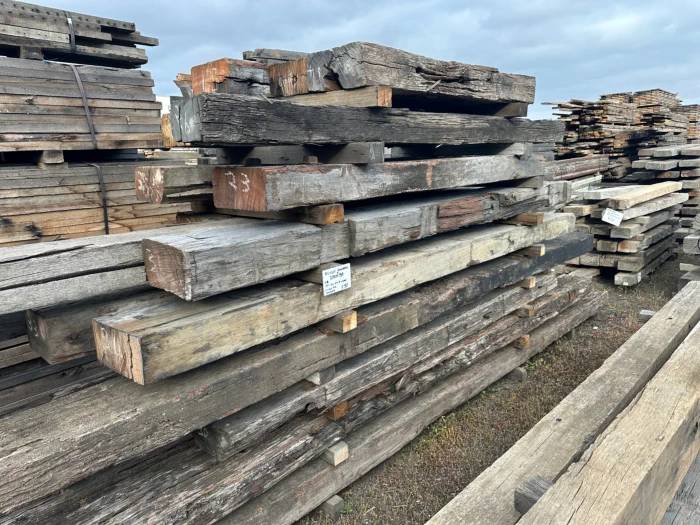 Stacked timber sleepers removed and recycled